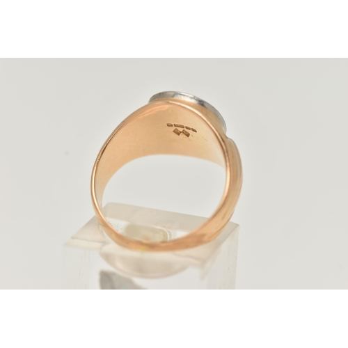 81 - AN 18CT GOLD BI COLOUR SIGNET RING, designed as a white gold oval face with etched crest, depicting ... 