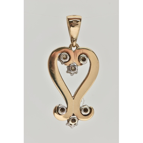 84 - A 9CT GOLD AND DIAMOND PENDANT, designed as an open work heart with scrolling detail, set with seven... 