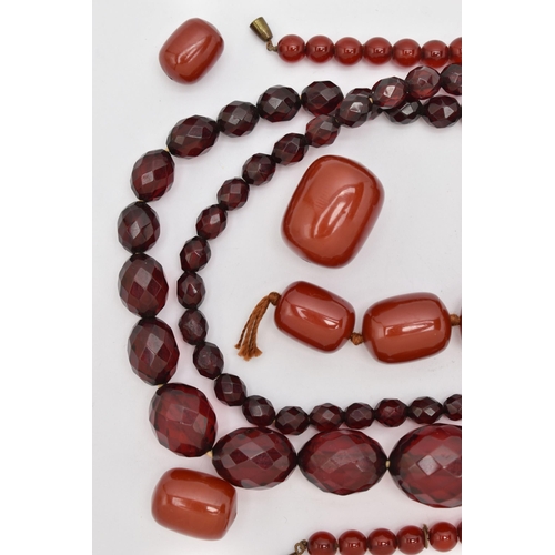 89 - AN ASSORTMENT OF BAKELITE CHERRY AMBER BEADS, to include a necklace comprised of graduating spherica... 