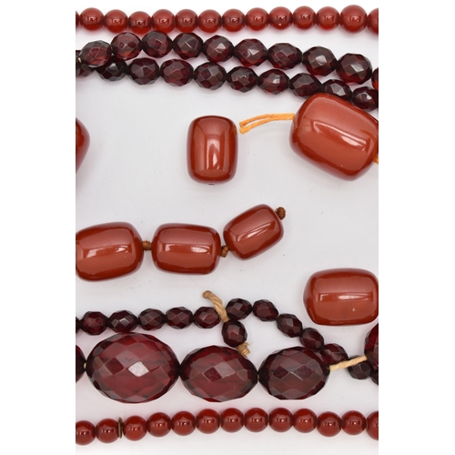 89 - AN ASSORTMENT OF BAKELITE CHERRY AMBER BEADS, to include a necklace comprised of graduating spherica... 