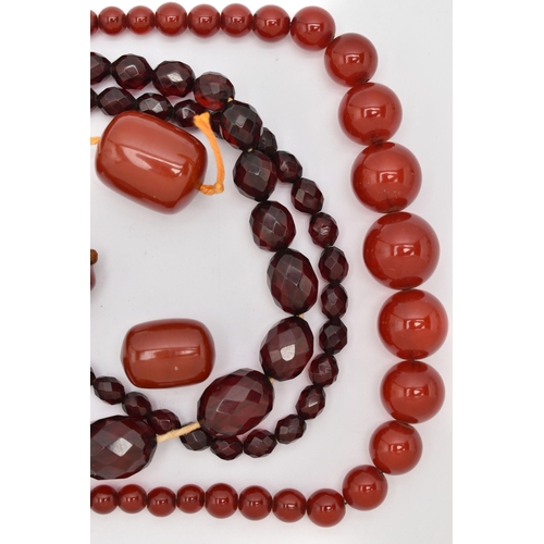 89 - AN ASSORTMENT OF BAKELITE CHERRY AMBER BEADS, to include a necklace comprised of graduating spherica... 