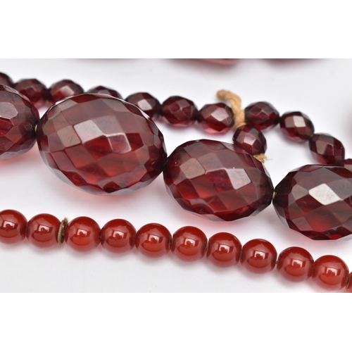 89 - AN ASSORTMENT OF BAKELITE CHERRY AMBER BEADS, to include a necklace comprised of graduating spherica... 