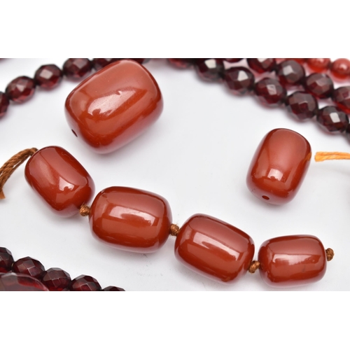 89 - AN ASSORTMENT OF BAKELITE CHERRY AMBER BEADS, to include a necklace comprised of graduating spherica... 