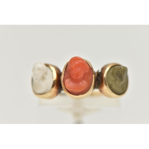 96 - A 19TH CENTURY LAVA CAMEO RING, three high relief cameos, worn faces, each collet set, to a thin pol... 