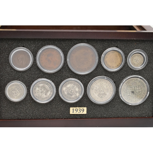 160 - A SMALL WOODEN COIN CABINET, consisting of eight drawers seven containing UK coinage from 1939-1945,... 