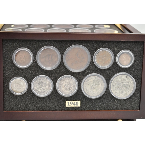 160 - A SMALL WOODEN COIN CABINET, consisting of eight drawers seven containing UK coinage from 1939-1945,... 