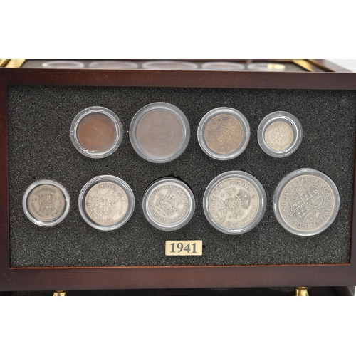 160 - A SMALL WOODEN COIN CABINET, consisting of eight drawers seven containing UK coinage from 1939-1945,... 