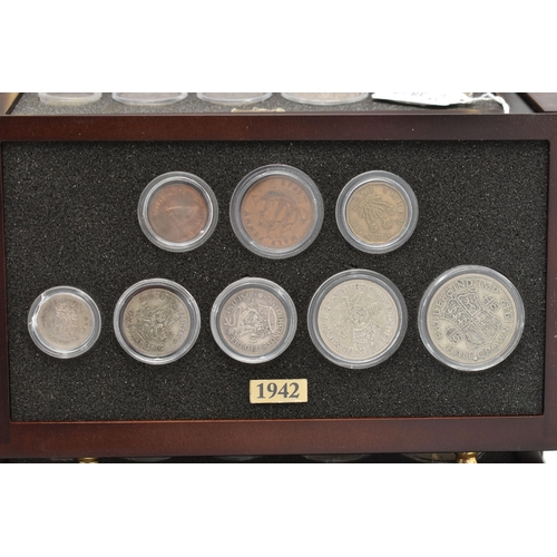 160 - A SMALL WOODEN COIN CABINET, consisting of eight drawers seven containing UK coinage from 1939-1945,... 