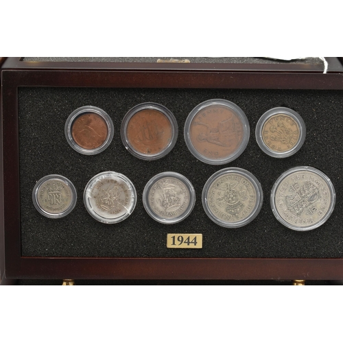 160 - A SMALL WOODEN COIN CABINET, consisting of eight drawers seven containing UK coinage from 1939-1945,... 