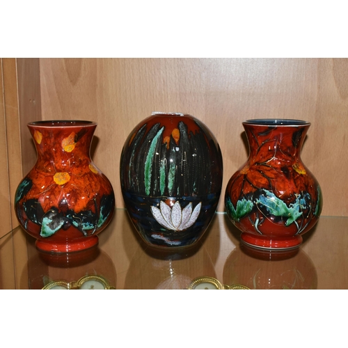 333 - THREE ANITA HARRIS ART POTTERY VASES, two florally decorated baluster vases, with printed backstamps... 