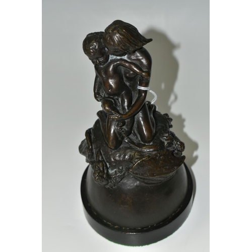 335 - A BRONZE FIGURE GROUP, depicting a mother and child kneeling on top of a mythical beast, loose on a ... 