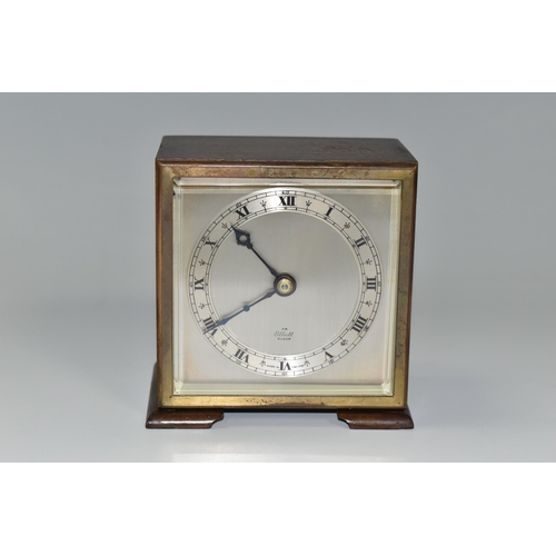 336 - A SMALL ELLIOTT MANTEL CLOCK, the case square in form, raised on two tapering feet, the dial marked ... 