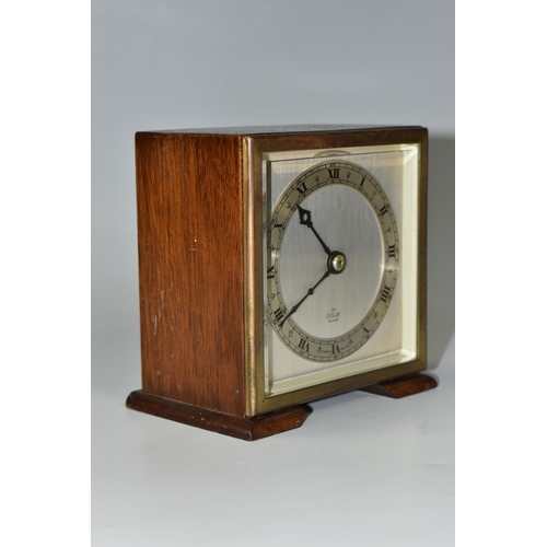 336 - A SMALL ELLIOTT MANTEL CLOCK, the case square in form, raised on two tapering feet, the dial marked ... 