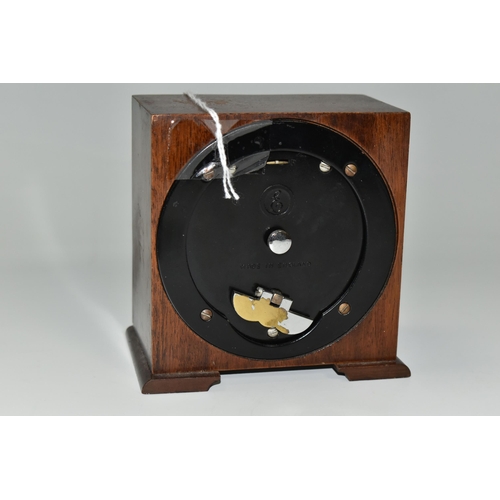 336 - A SMALL ELLIOTT MANTEL CLOCK, the case square in form, raised on two tapering feet, the dial marked ... 