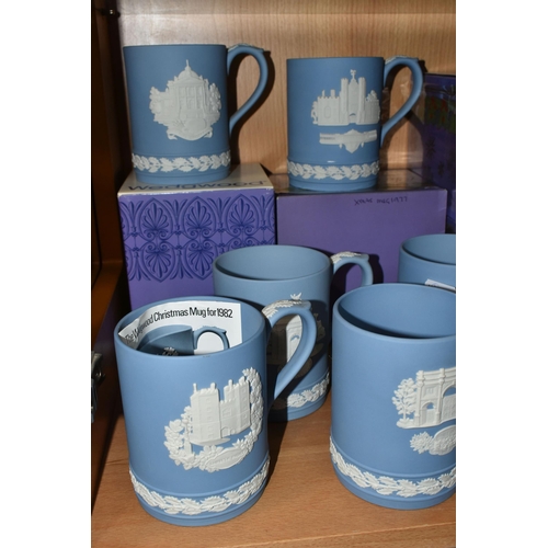 339 - FIFTEEN WEDGWOOD JASPERWARE CHRISTMAS MUGS, in pale blue, decorated with Royal Palaces and London la... 