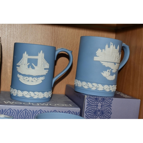 339 - FIFTEEN WEDGWOOD JASPERWARE CHRISTMAS MUGS, in pale blue, decorated with Royal Palaces and London la... 