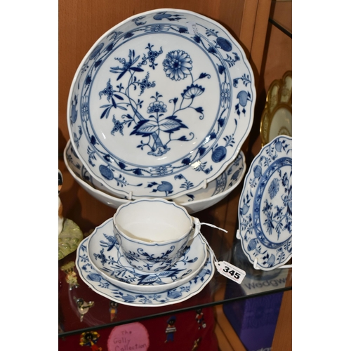 345 - SIX PIECES OF MEISSEN 'BLUE ONION' TEA/DINNER WARE, comprising a teacup and saucer, two side plates ... 