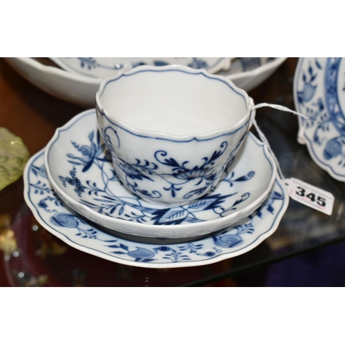 345 - SIX PIECES OF MEISSEN 'BLUE ONION' TEA/DINNER WARE, comprising a teacup and saucer, two side plates ... 