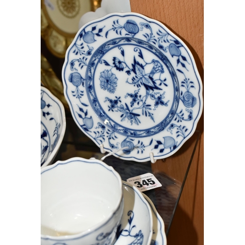 345 - SIX PIECES OF MEISSEN 'BLUE ONION' TEA/DINNER WARE, comprising a teacup and saucer, two side plates ... 