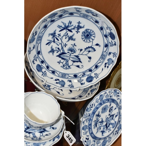 345 - SIX PIECES OF MEISSEN 'BLUE ONION' TEA/DINNER WARE, comprising a teacup and saucer, two side plates ... 