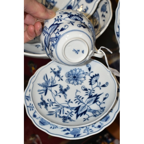 345 - SIX PIECES OF MEISSEN 'BLUE ONION' TEA/DINNER WARE, comprising a teacup and saucer, two side plates ... 