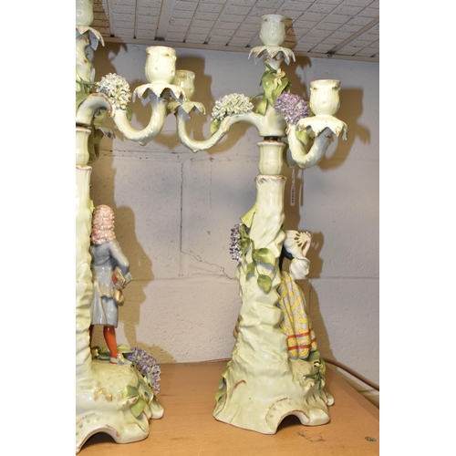 350 - A PAIR OF PLAUE FIGURAL CANDELABRA, the four sconce candelabra decorated with detailed modelled flow... 