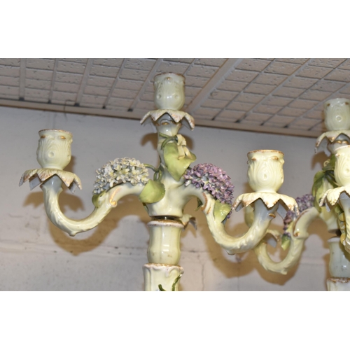 350 - A PAIR OF PLAUE FIGURAL CANDELABRA, the four sconce candelabra decorated with detailed modelled flow... 