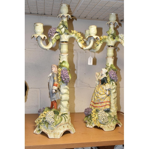 350 - A PAIR OF PLAUE FIGURAL CANDELABRA, the four sconce candelabra decorated with detailed modelled flow... 