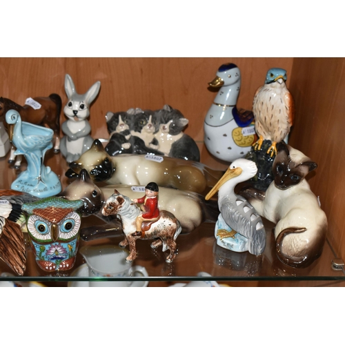 356 - A COLLECTION OF ANIMAL AND BIRD FIGURES, over twenty pieces, to include a Beswick lying down Siamese... 