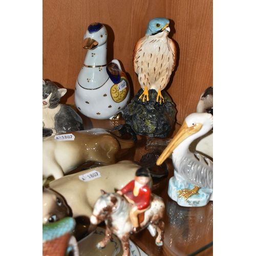 356 - A COLLECTION OF ANIMAL AND BIRD FIGURES, over twenty pieces, to include a Beswick lying down Siamese... 