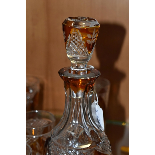 357 - A CONTINENTAL AMBER CUT TO CLEAR DECANTER AND GLASSES, the part set incudes mallet form decanter wit... 