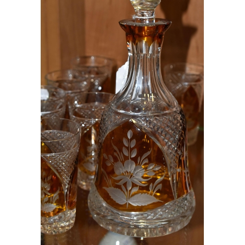 357 - A CONTINENTAL AMBER CUT TO CLEAR DECANTER AND GLASSES, the part set incudes mallet form decanter wit... 