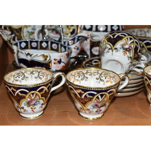 383 - A GROUP OF TEA WARE, comprising a hand painted part tea set: a cake plate, a slop bowl, five teacups... 