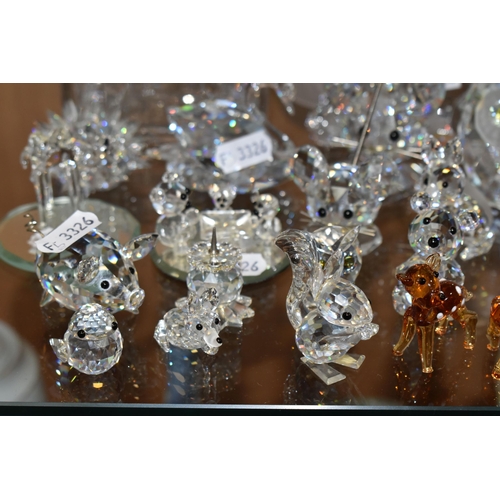 391 - A COLLECTION OF SWAROVSKI CRYSTAL AND OTHER DECORATIVE GLASS WARE, Swarovski figures to include owls... 