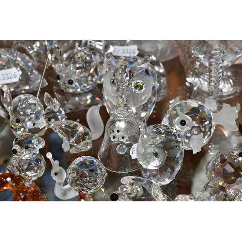 391 - A COLLECTION OF SWAROVSKI CRYSTAL AND OTHER DECORATIVE GLASS WARE, Swarovski figures to include owls... 