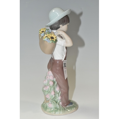 392 - A LLADRO 'GATHERING FLOWERS' FIGURE, model no 8675, a 60th Anniversary figure issued in 2013, sculpt... 