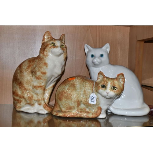 397 - A GROUP OF TWO WINSTANLEY POTTERY CATS AND ONE SIMILAR, comprising a seated ginger cat, signed and m... 