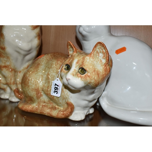 397 - A GROUP OF TWO WINSTANLEY POTTERY CATS AND ONE SIMILAR, comprising a seated ginger cat, signed and m... 