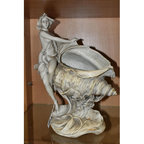 399 - A ROYAL DUX LADY SEATED ON A SHELL FIGURINE, matt white glaze, model 1383, with applied pink Royal D... 