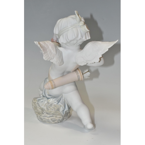 401 - A BOXED LLADRO 'STRAIGHT TO THE HEART' FIGURINE, a matte white porcelain with soft colours, model 92... 