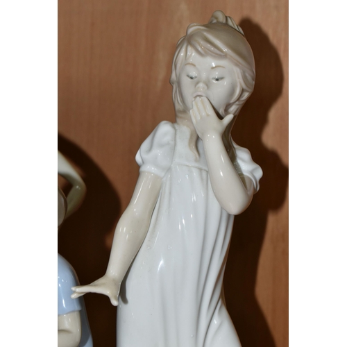 406 - A GROUP OF THREE NAO FIGURES, comprising 'My Feathered Friend' model no 1353, 'Girl Yawning', height... 