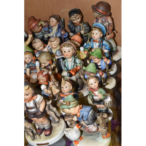 414 - A GROUP OF TWENTY SIX MID-CENTURY GOEBEL FIGURES, comprising 195 Barnyard Hero, 110 Lets Sing, 69 Ha... 