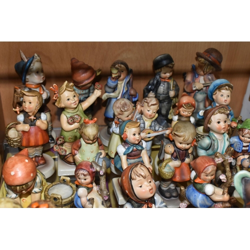 414 - A GROUP OF TWENTY SIX MID-CENTURY GOEBEL FIGURES, comprising 195 Barnyard Hero, 110 Lets Sing, 69 Ha... 