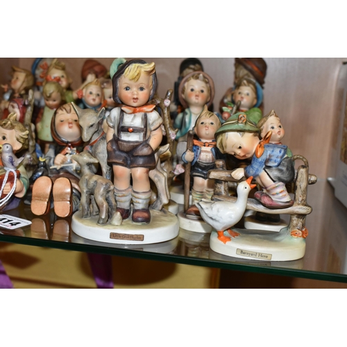 414 - A GROUP OF TWENTY SIX MID-CENTURY GOEBEL FIGURES, comprising 195 Barnyard Hero, 110 Lets Sing, 69 Ha... 