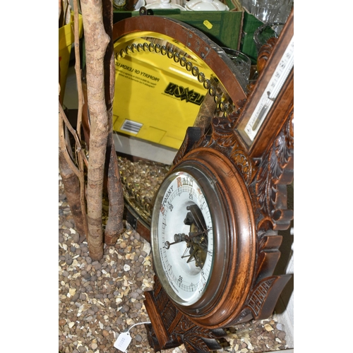 525 - AN OAK BAROMETER AND A COPPER FRAMED MIRROR, comprising a carved banjo barometer with thermometer on... 