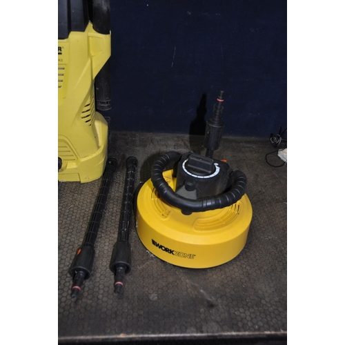 A KARCHER K2 PRESSURE WASHER with lance, two attachment, patio