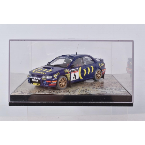 112 - SIX BOXED MODEL VEHICLES, trofeu Subaru Impreza World Champion 95 numbered 606, the second is a Spar... 