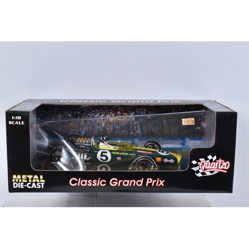 120 - SEVEN BOXED DIECAST MODEL RACING VEHICLES, the first a 1:18 scale Quartzo Classic Grand Prix Lotus 4... 