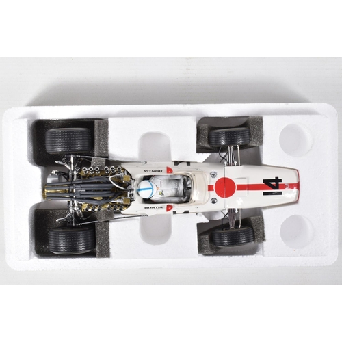 120 - SEVEN BOXED DIECAST MODEL RACING VEHICLES, the first a 1:18 scale Quartzo Classic Grand Prix Lotus 4... 