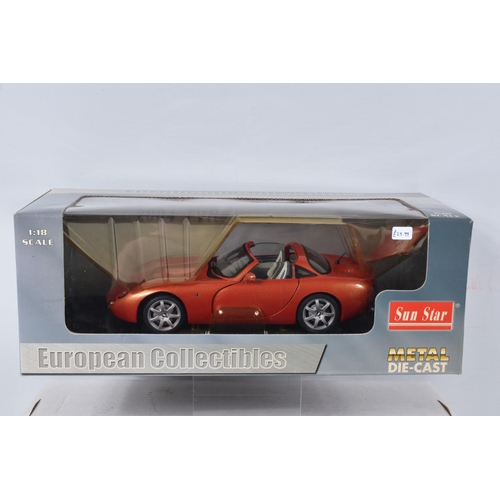 122 - FIVE BOXED AND FOUR LOOSE MODEL VEHICLES,  boxed models include a 1:18 scale Maisto Aston Martin DB7... 